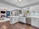 Open concept kitchen with stainless appliances and seamless views into the cozy living space at 11237 Baycreek Dr, Indianapolis, IN 46236