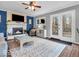 Cozy living room with fireplace and doors to outdoor deck at 11237 Baycreek Dr, Indianapolis, IN 46236