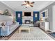 Cozy living room featuring a charming fireplace and comfortable seating arrangement at 11237 Baycreek Dr, Indianapolis, IN 46236