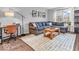 Cozy living room with modern decor, a large sofa, and natural light from the window at 11237 Baycreek Dr, Indianapolis, IN 46236