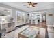 Open-concept living room showcasing hardwood floors, modern decor, and abundant natural light from French doors at 11237 Baycreek Dr, Indianapolis, IN 46236
