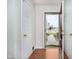 Inviting entryway featuring gleaming hardwood floors, multiple closets, and a clear view of the outdoors through the glass storm door at 12243 Carriage Stone Dr, Fishers, IN 46037