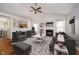 Bright living room features a fireplace, vaulted ceiling, and plush seating, perfect for relaxing or entertaining at 12243 Carriage Stone Dr, Fishers, IN 46037