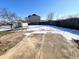 Backyard with shed, patio, and a partially snow-covered yard at 123 S Morris Blvd, Bargersville, IN 46106