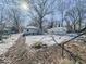 Large backyard with detached garage and snowy landscape at 1307 W Congress Ave, Indianapolis, IN 46208