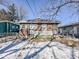 Brick home with detached garage and snowy backyard at 1307 W Congress Ave, Indianapolis, IN 46208