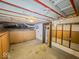 Unfinished basement with utilities and storage at 1307 W Congress Ave, Indianapolis, IN 46208