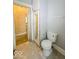 Small bathroom with toilet and access to bedroom at 1307 W Congress Ave, Indianapolis, IN 46208