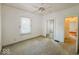Bright bedroom with mirrored closet and window at 1307 W Congress Ave, Indianapolis, IN 46208