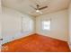 Bright bedroom with orange carpeting and a window at 1307 W Congress Ave, Indianapolis, IN 46208