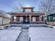 Brick home with front porch and steps, winter scene at 1307 W Congress Ave, Indianapolis, IN 46208