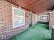 Brick front porch with metal security door at 1307 W Congress Ave, Indianapolis, IN 46208