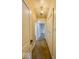 Long hallway with patterned wallpaper and doors at 1307 W Congress Ave, Indianapolis, IN 46208