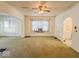 Bright living room with a large window and ceiling fan at 1307 W Congress Ave, Indianapolis, IN 46208