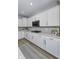 White kitchen with quartz countertops and stainless steel appliances at 13643 E 131St St # 4B, Fishers, IN 46037