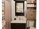 Well-lit bathroom featuring a vanity with mirror and storage cabinet at 1719 Fletcher Ave, Indianapolis, IN 46203