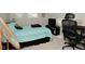 This bedroom features a queen bed, a fan, and an entertainment center, providing ample storage space at 1719 Fletcher Ave, Indianapolis, IN 46203