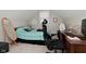 Cozy bedroom features a bed, desk area, and neutral-colored walls, creating a comfortable space at 1719 Fletcher Ave, Indianapolis, IN 46203