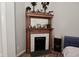 Charming fireplace with decorative wood mantle and white tile surround at 1719 Fletcher Ave, Indianapolis, IN 46203