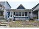 Charming single-story home with a front porch and inviting curb appeal at 1719 Fletcher Ave, Indianapolis, IN 46203
