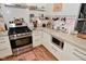 Kitchen featuring stainless steel appliances, subway tile backsplash, modern range and lots of cabinet space at 1719 Fletcher Ave, Indianapolis, IN 46203