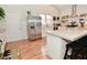 Eat-in kitchen featuring stainless steel appliances, white cabinets and large center island with seating at 1719 Fletcher Ave, Indianapolis, IN 46203