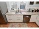 White cabinets and concrete countertops provide a clean modern feel to this well-lit kitchen at 1719 Fletcher Ave, Indianapolis, IN 46203