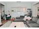 Bright living room with a sectional sofa, modern lighting, and an accent chair at 1719 Fletcher Ave, Indianapolis, IN 46203