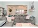 Bright living room with a sectional sofa and an open concept kitchen view at 1719 Fletcher Ave, Indianapolis, IN 46203