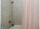 Shower with tiled walls and pink curtain at 1719 Fletcher Ave, Indianapolis, IN 46203