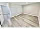 Simple bedroom with grey walls and wood-look flooring at 233 Howard St, Greenfield, IN 46140