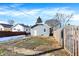 Backyard view showing a detached garage and a partially snow-covered yard at 2743 Barth Ave, Indianapolis, IN 46203