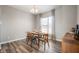 Charming dining room with mid-century modern furniture and hardwood floors at 2947 Kirkbride Way, Indianapolis, IN 46222