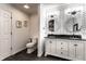 Stylish bathroom featuring modern fixtures, vanity, round mirrors, and trendy wallpaper at 333 S 4Th St, Zionsville, IN 46077