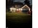 Attractive home exterior at night with string lights and landscaping at 333 S 4Th St, Zionsville, IN 46077