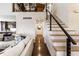 Bright living room with hardwood floors, stairs, and a modern sofa, perfect for relaxation at 333 S 4Th St, Zionsville, IN 46077