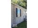 Tan brick house with black shutters and a small window at 3726/3722/3716 N Emerson Ave, Indianapolis, IN 46218