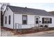 White house with black window frames and a chain link fence at 3726/3722/3716 N Emerson Ave, Indianapolis, IN 46218