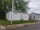 Small white house needing some repairs at 3726/3722/3716 N Emerson Ave, Indianapolis, IN 46218