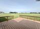 Relax on the wooden deck with a gorgeous panoramic view of the vast, green backyard at 373 Brianne Ln, Danville, IN 46122