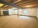 Large unfinished basement with carpeted flooring, insulated walls, and exposed utilities at 373 Brianne Ln, Danville, IN 46122