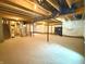 Unfinished basement featuring insulated walls and carpeted flooring at 373 Brianne Ln, Danville, IN 46122