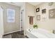 Bathroom with garden tub and tile floor at 373 Brianne Ln, Danville, IN 46122