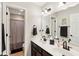Bathroom with double vanity, shower, and black accents at 373 Brianne Ln, Danville, IN 46122