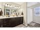 Double vanity bathroom with shower and tile floor at 373 Brianne Ln, Danville, IN 46122