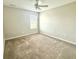 Cozy bedroom featuring neutral walls, plush carpeting, and a bright, sunlit window at 373 Brianne Ln, Danville, IN 46122