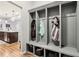 Gray coat closet with cubbies and hooks for storage, located near kitchen at 373 Brianne Ln, Danville, IN 46122