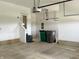 Spacious garage with an automatic door opener, extra storage space, and a convenient side entrance at 373 Brianne Ln, Danville, IN 46122