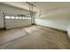 Spacious two-car garage featuring a clean, concrete floor and an automatic door opener at 373 Brianne Ln, Danville, IN 46122
