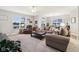 Open living room with sectional sofa and a view into kitchen at 373 Brianne Ln, Danville, IN 46122